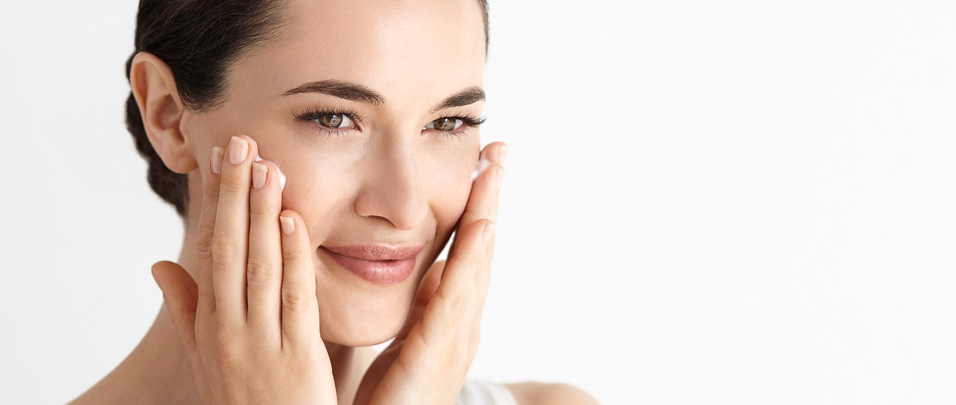 Woman touching her face with her left hand