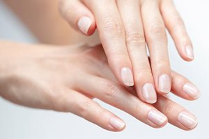 Cracked skin is common on fingers, hands and feet