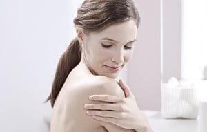 Woman applying Eucerin product on her hand